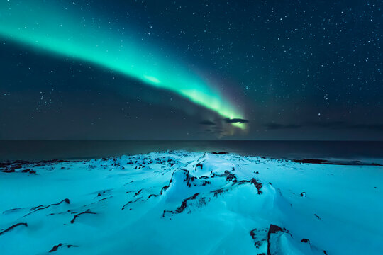 Northern lights above the beach, Berlevag, Norway