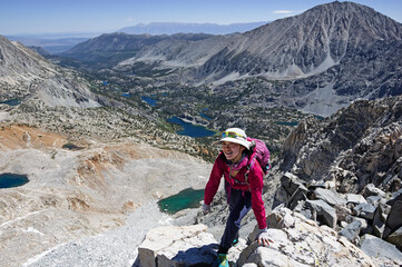 Woman Reaching Treasure Peak Summit
