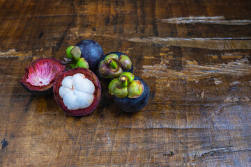 Fresh mangosteen fruit on a wooden table
