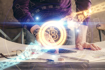 Double exposure of man's hands holding and using a phone and crypto currency blockchain theme drawing.