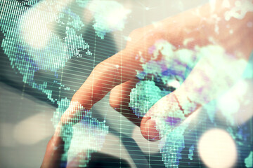 Double exposure of man's hands holding and using a phone and international business theme drawing.