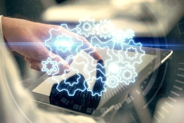 Double exposure of man's hands holding and using a phone and international business theme drawing.