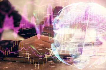 Double exposure of man's hands holding and using a phone and financial graph drawing. Analysis concept.