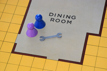 Detail of a board game with two players and a murder weapon