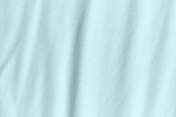 Silk fabric in turquoise color as background and texture