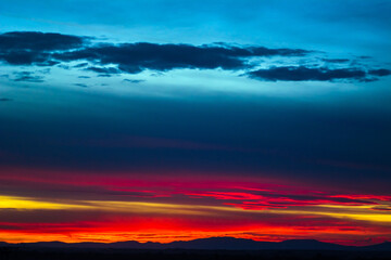 Natural Sunset. Bright Dramatic Sky And Dark Ground. Landscape Under Scenic Colorful Sky. Sun Over Skyline, Horizon. Transcarpathia and Uzhhorod. Magic Sunset. Dusk. Clouds.