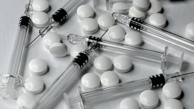 Syringes and Medical Pills and Drugs Slider Shot Close-up .