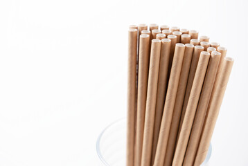 Paper straws in a glass.
