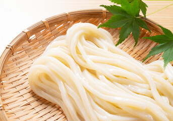Japanese Ingredients.Cold udon noodles on a bamboo colander