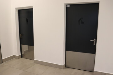 toilet rooms with symbols in business center
