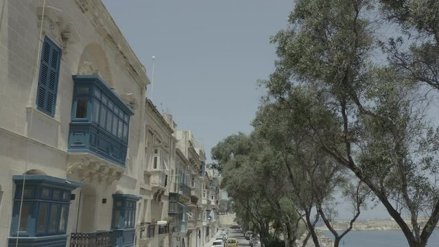 Drone flying back through beautiful old street, close to sea in Valletta, Malta . Old, vintage windows, balconies. - 4K stock video
Europe, Malta, Valletta, 4K Resolution, Above