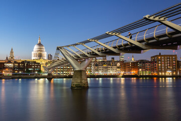 Fototapeta na wymiar Millenium Bridge and London skyline at night