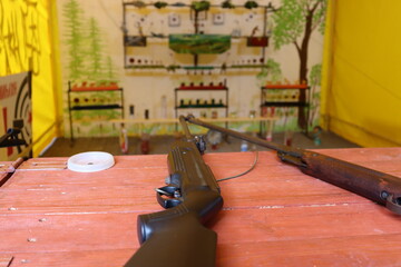 shooting range with gun on table