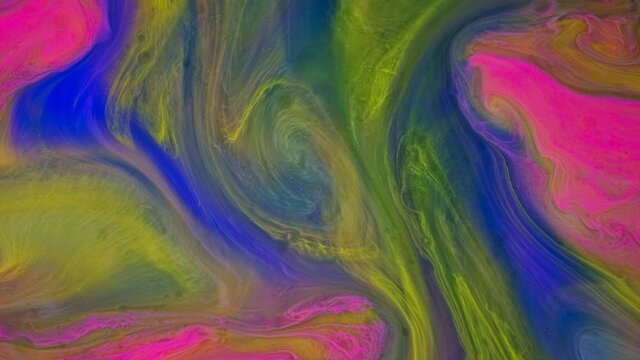 Smooth liquid gradient colorful paints moving slowly. Stock footage. Close up of rainbow color inks mixing in liquid substance, concept of art.