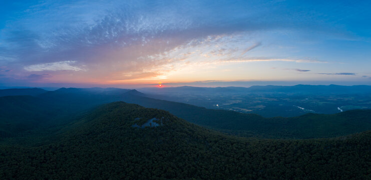 An aerial panoramic shot of the sunrise as seen from Duncan Knob, part of the Massanutten Range, in the George Washington National Forest, in Page County Virginia.
