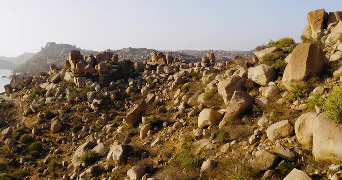 Aerial view of rock boulders at Sanapur lake, golden hour, Hampi, India