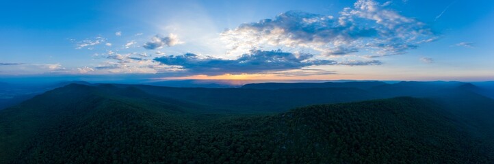 An aerial panorama of sunset as seen from above Duncan Knob, part of the Massanutten Range, in the George Washington National Forest, in Page County Virginia.