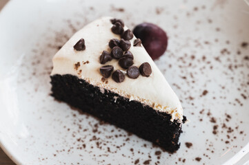 Black beer cake topped with cream cheese and dark chocolate chip
