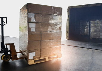 Packaging Boxes Stacked Wrapped Plastic on Pallets Loading into Shipping Cargo Container. Loading...