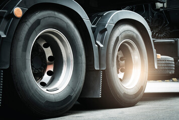 Close-up a large truck wheels and tires of semi truck.