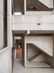 concrete geometrical wall of a building on a cloudy day soft shadows