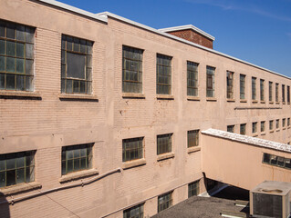 pink brick wall building in an industrial area