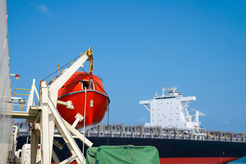 A large rescue crew boat is attached to the brackets on the deck of the ship, Rescue boat in David