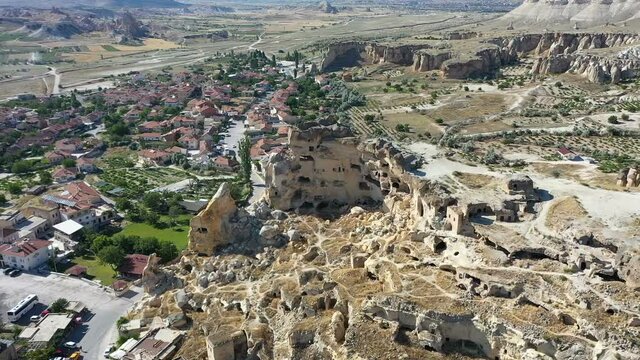 Aerial view of Cavusin-Cappadocia A lot of stone houses and churchs. ancient village Cavusin. turkey tourism trip. aerial shooting drone. in Nevsehir Turkey fairy chimneys.drone shooting 