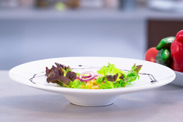 Delicious scrambled eggs with lettuce and purple onion slices