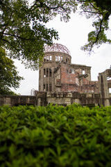 Hiroshima,Japan-July 2019: Hiroshima Peace Memorial Park Atomic Bomb Dome surrounded with green trees.