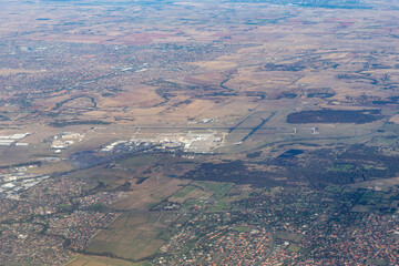 Fototapeta na wymiar Aerial overview of Melbourne Airport and surrounding suburbs. .
