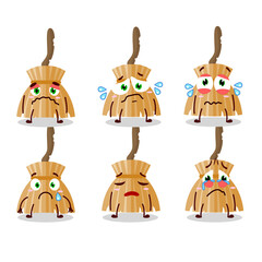Witch broom cartoon character with sad expression