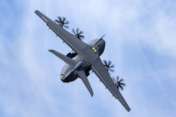 Four engined cargo aircraft in a steep turn.