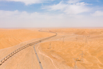 aerial view of road and railway  in the desert