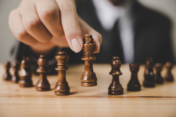 Businessman with chess board game. Plan stratgy and tactic concept