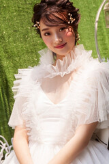 Beautiful young Asian woman wearing white dress