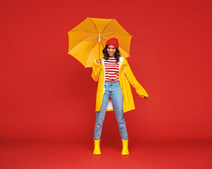 Happy ethnic female on rainy day.