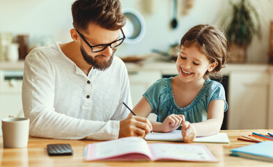 Father helping daughter with homework.