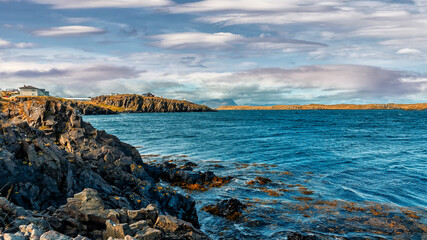 Tipical Icelandic Seascape in sunny day. Amazing nature landscape of Iceland. Iceland one famous natural landmark and travel destination place. Iconic location for landscape photographers