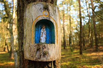 Old wooden chapel on a tree in the forest