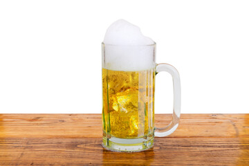 The glass of cold beer on the table