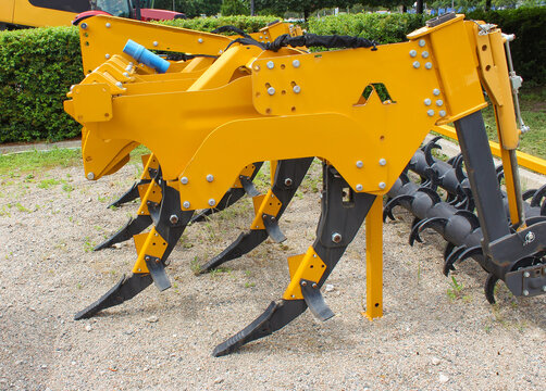 Plow for plowing soil. Subsoiler or flat lifter. Plow on trailer for tractor. Trailers for agricultural machinery.