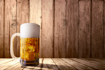 The glass of cold beer on the table