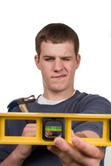 Young man eyeing a hand level- a series