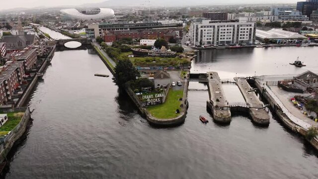Grand Canal dock drone aerial fly backward reveal of Dublin Docklands, Capital Dock, Grand Canal Dock, Aviva stadium.