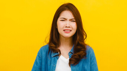 Portrait of young Asian lady with negative expression, excited screaming, crying emotional angry in...