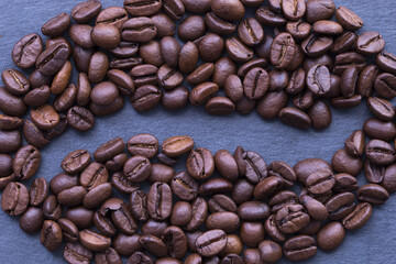 Coffee beans sign or symbol on dark or graphite background
