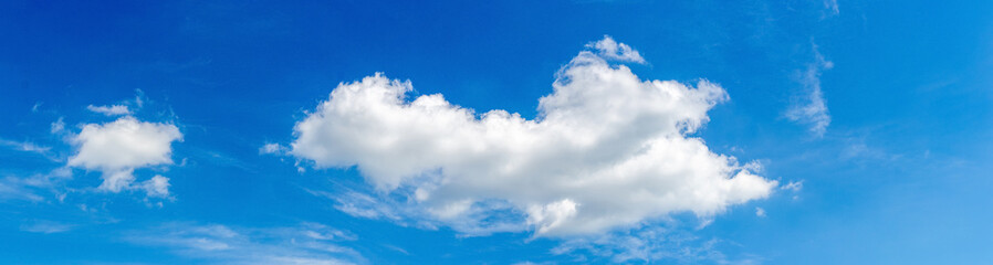 Naklejka na ściany i meble Blue sky with light curly clouds, panorama