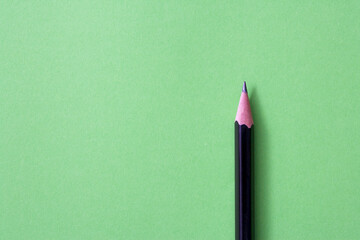 pencil isolated on green background
