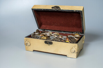 small carved box with old coins